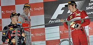 Vettel, Button e Alonso sul podio di Singapore. Afp