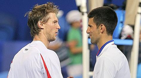 Novak Djokovic, 25 anni, saluta l'azzurro Andreas Seppi. Afp