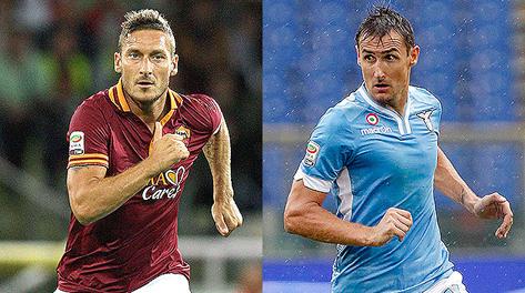 La sfida del gol  fra Francesco Totti e Miroslav Klose. Forte-Reuters