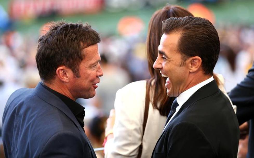 Matthaeus e Fabio Cannavaro scherzano in tribuna. Getty