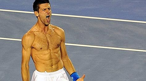 Novak Djokovic festeggia la vittoria dell'Open d'Australia 2012 su Rafa Nadal. Afp 