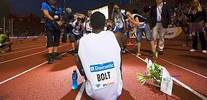 Usain Bolt provato dalla fatica al termine della gara. Afp