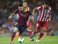 Leo Messi contro Arda Turan in Bara-Atletico. Ansa