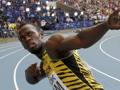 Usain Bolt festeggia l'oro nella 4x100 ai Mondiali in Russia del 2013. Ap