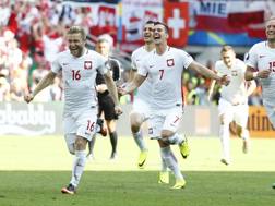 L'esultanza dei giocatori della Polonia. Reuters