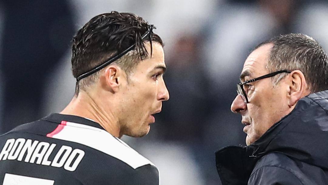 Cristiano Ronaldo e Maurizio Sarri. Afp 