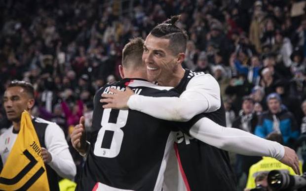 Ronaldo esulta con Ramsey. Getty Ronaldo esulta con Ramsey. Getty